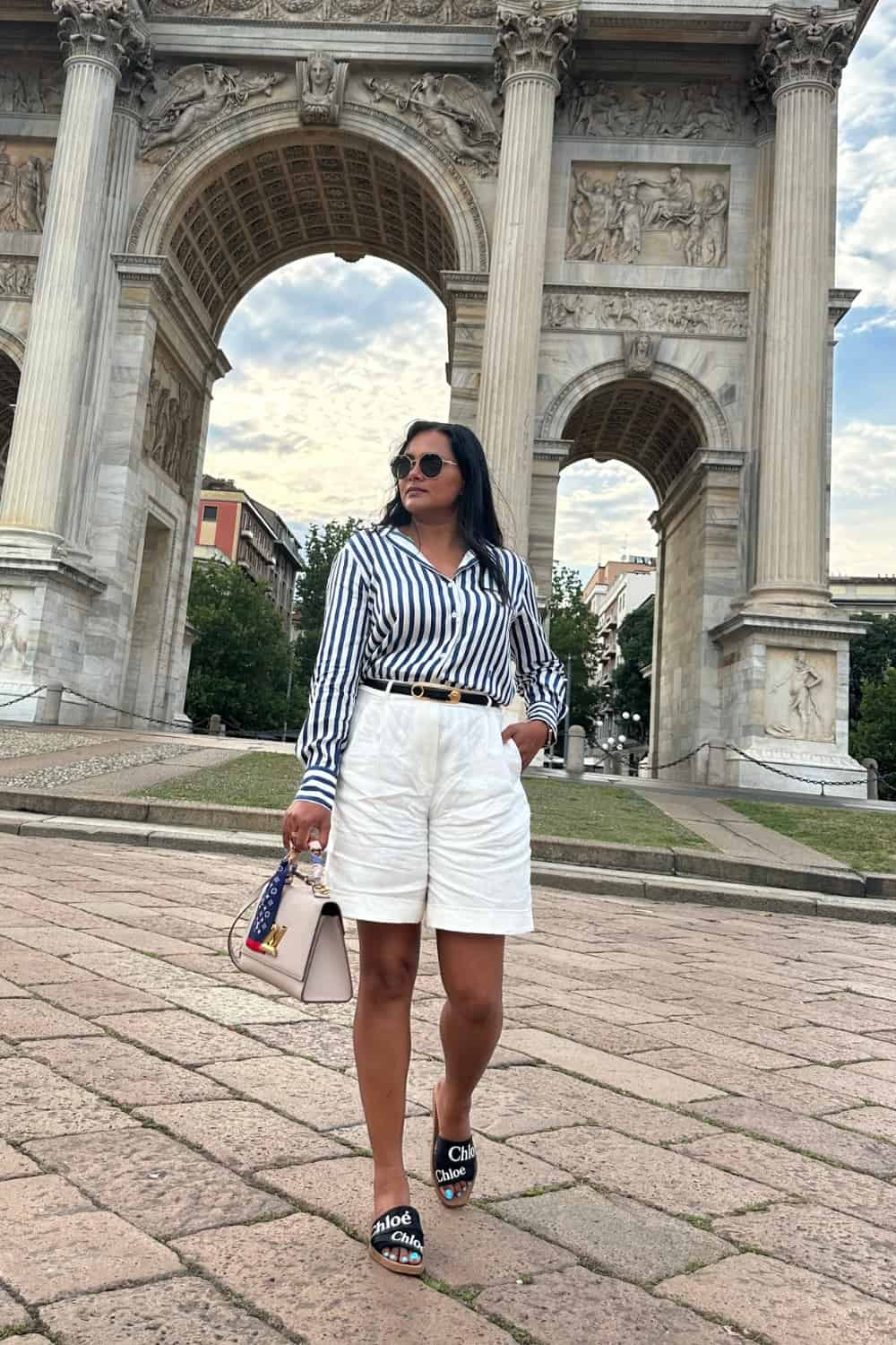 Summer travel capsule wardrobe outfit with shorts