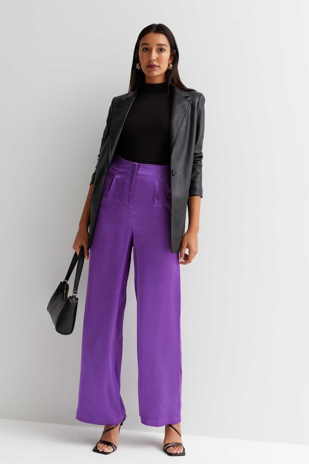 Colored satin pants outfit with leather blazer and sweater