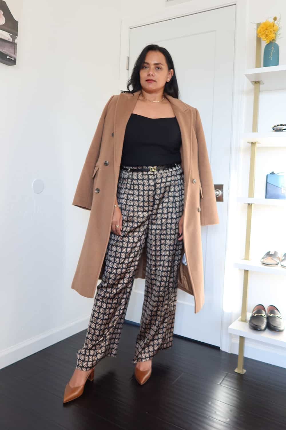 Printed Satin pants outfit with black sweater and coat
