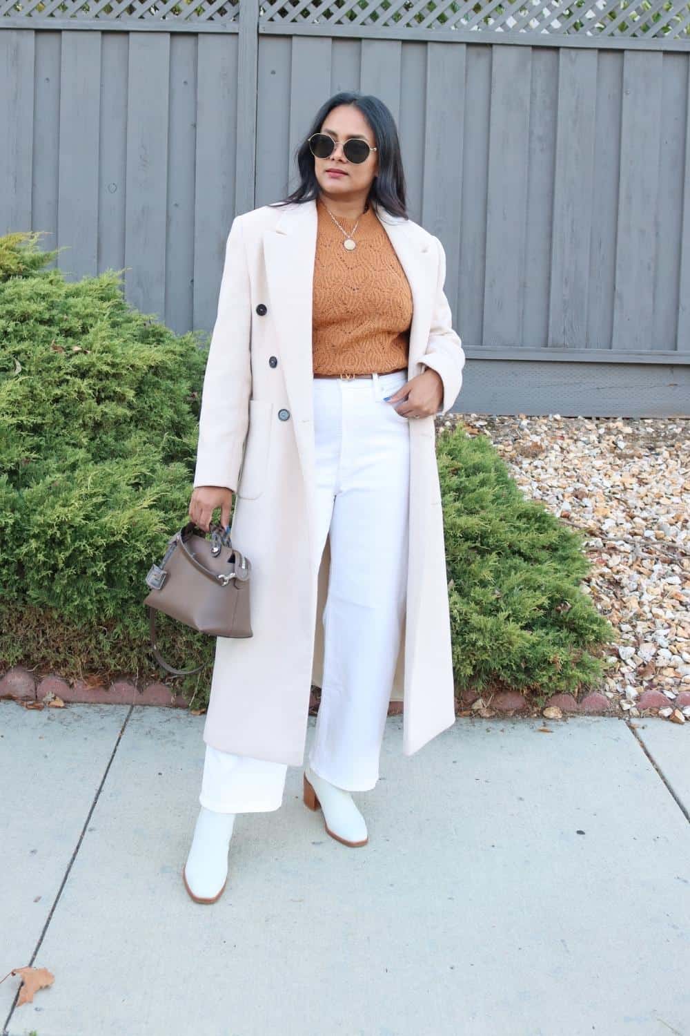 White wide leg jeans with white double breasted wool coat
