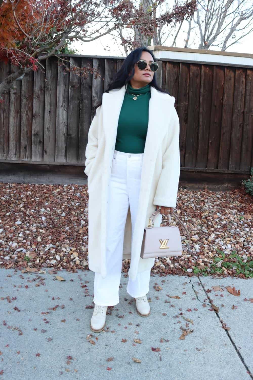 White wide leg jeans with faux fur coat and combat boots
