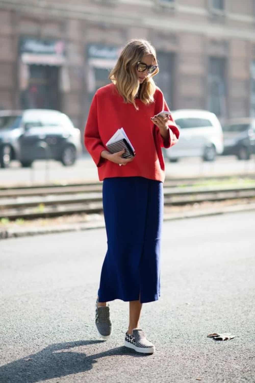 Sneakers with sweater over dress
