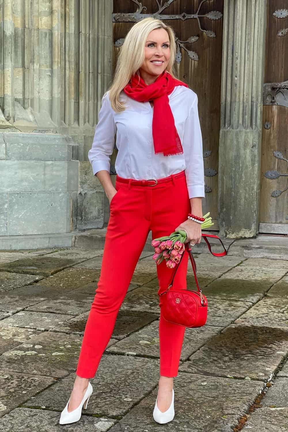 Red pants outfit with white button down shirt and red scarf