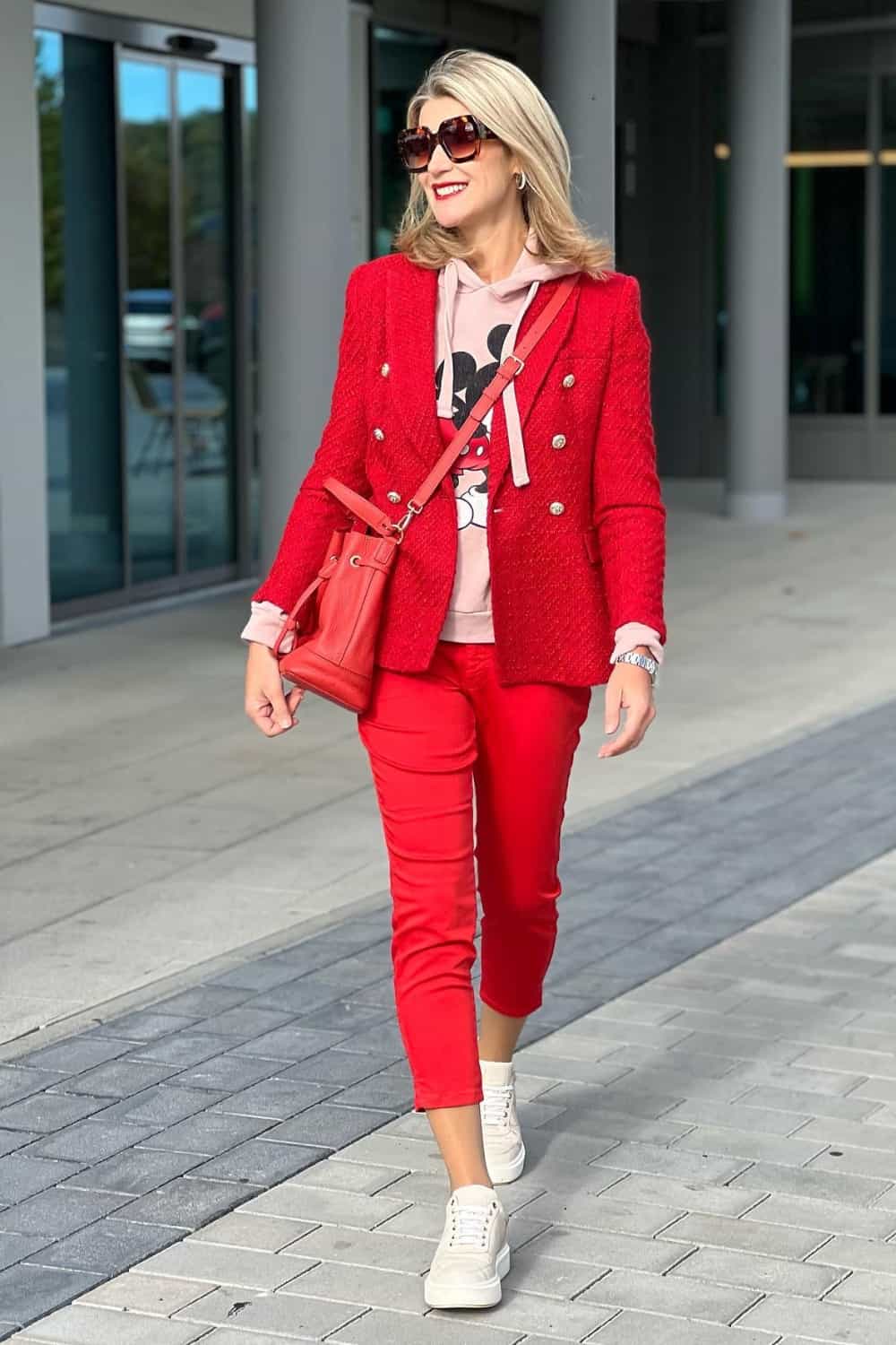 Red pants outfit with pink sweatshirt and red blazer