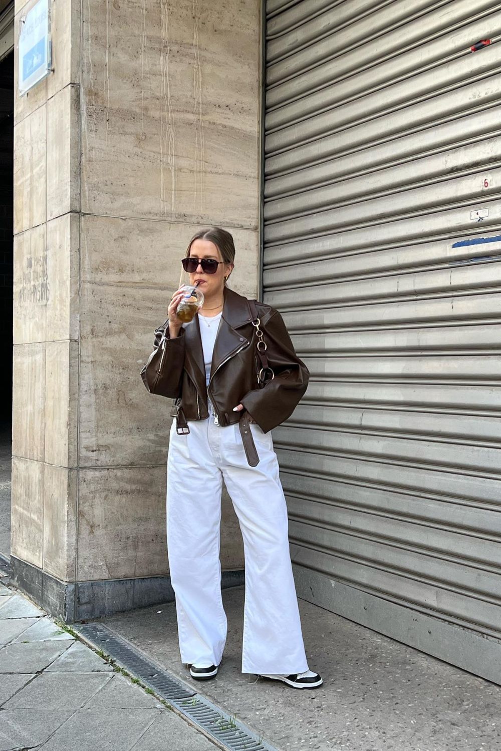 White Jeans and Wear with a Brown Leather Jacket