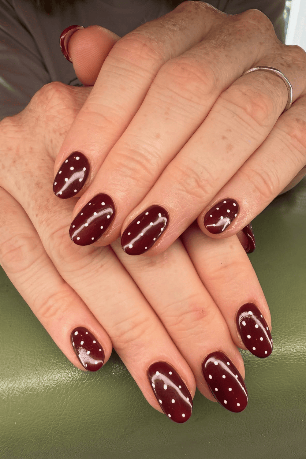 Burgundy nails with polka dot